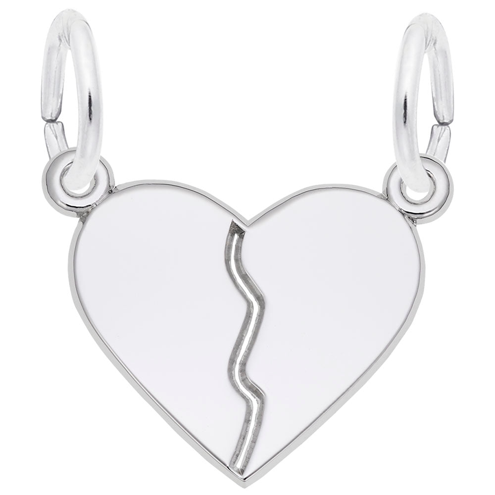 Silver heart-shaped break-apart charm with on a white background
