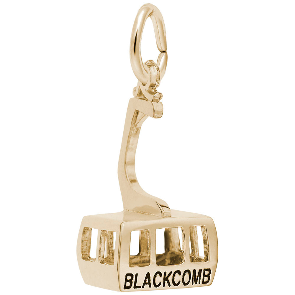 Gold cable car charm with 'BLACKCOMB' text on a white background