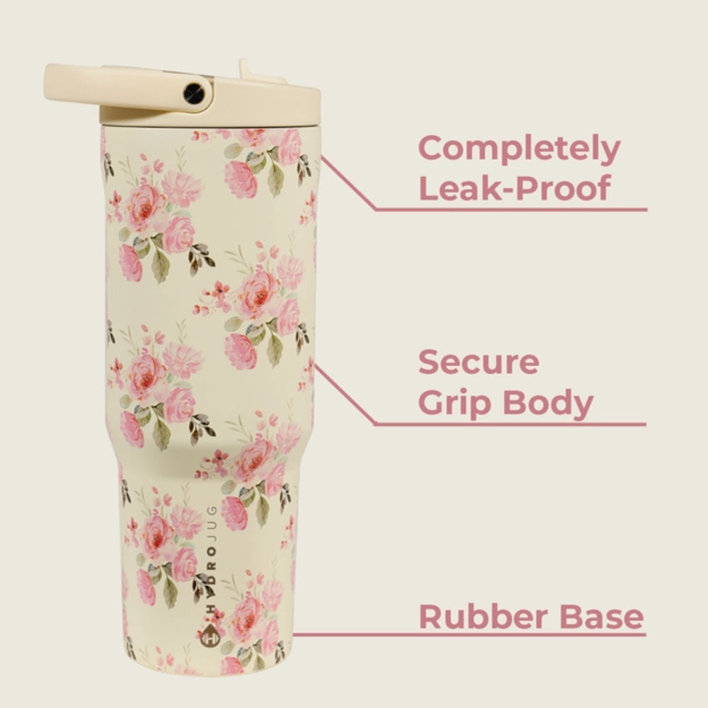 Floral-patterned tumbler with text highlighting features on a beige background.