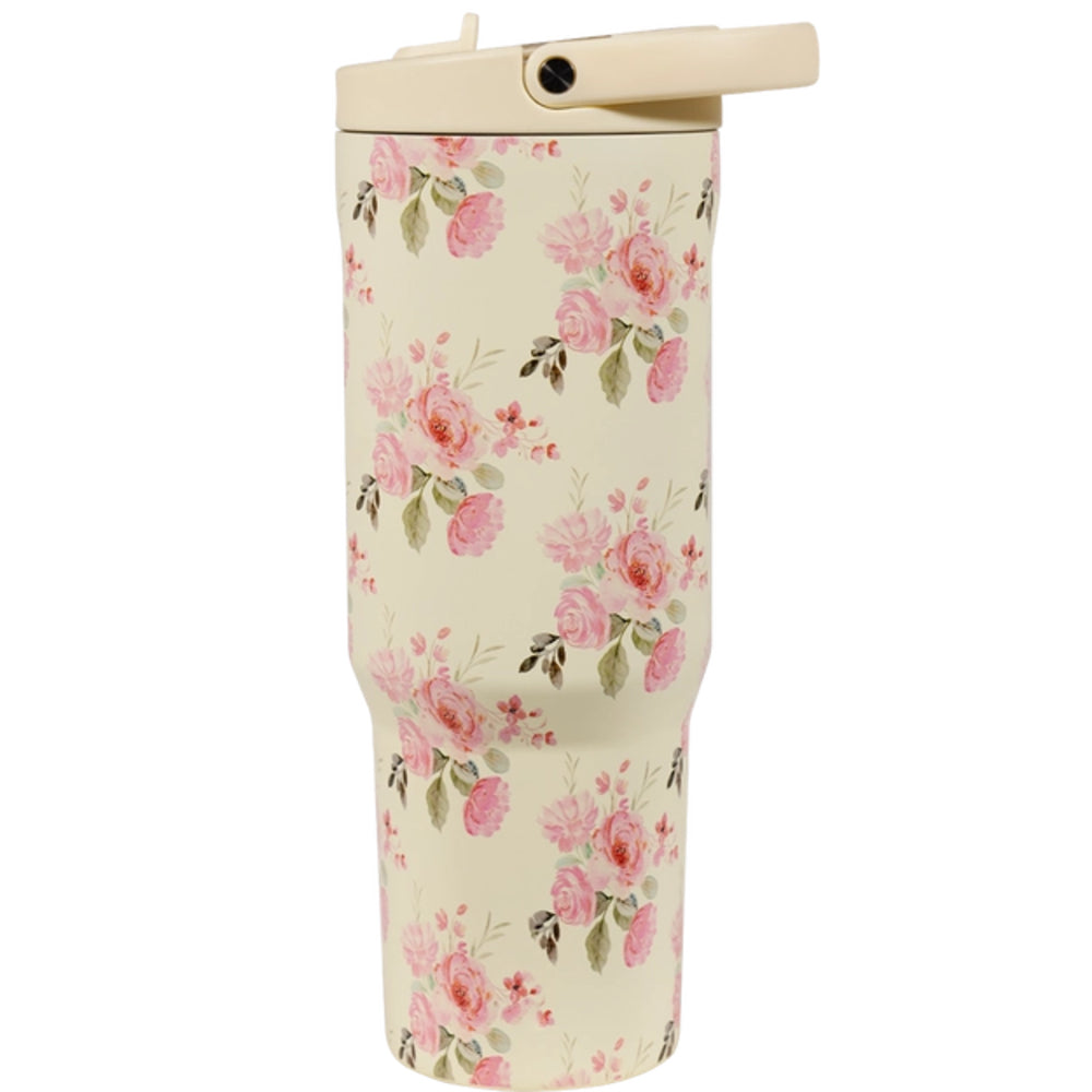 A photo showing a second side of a cream floral-patterned tumbler with beige lid and handle on a white background.