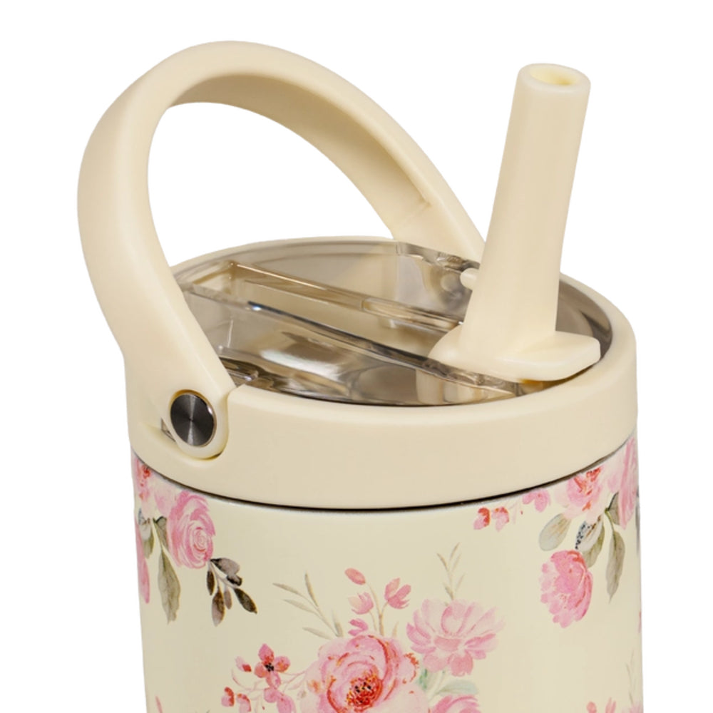 A photo showing the top of a cream-colored tumbler with floral design, handle, and straw with a clear lid on a white background.