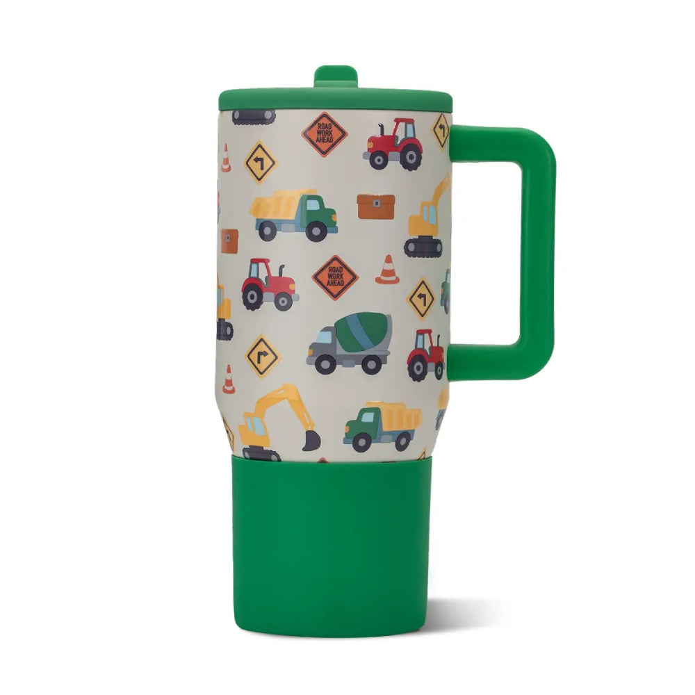 A travel mug with a green handle and lid, featuring a cream-colored wrap printed with colorful construction vehicles and road signs, set against a plain white background.