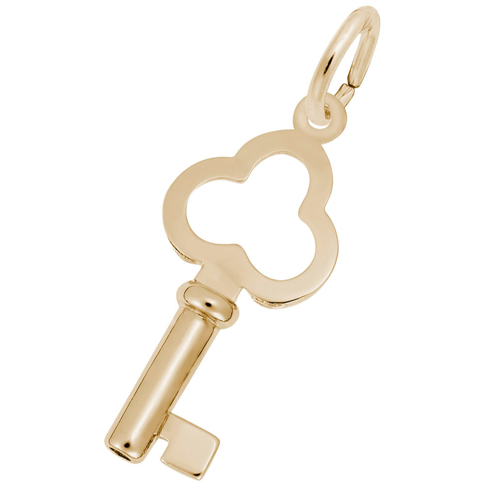 A Gold key shaped charm on a white background