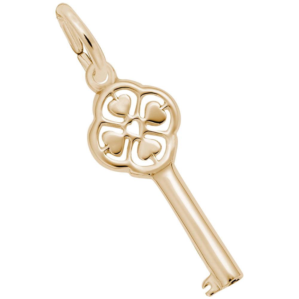 Gold key-shaped charm with decorative heart design on a white background