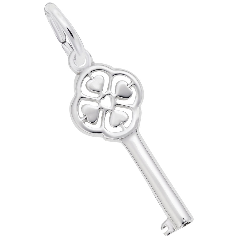 Silver key-shaped charm with decorative heart design on a white background