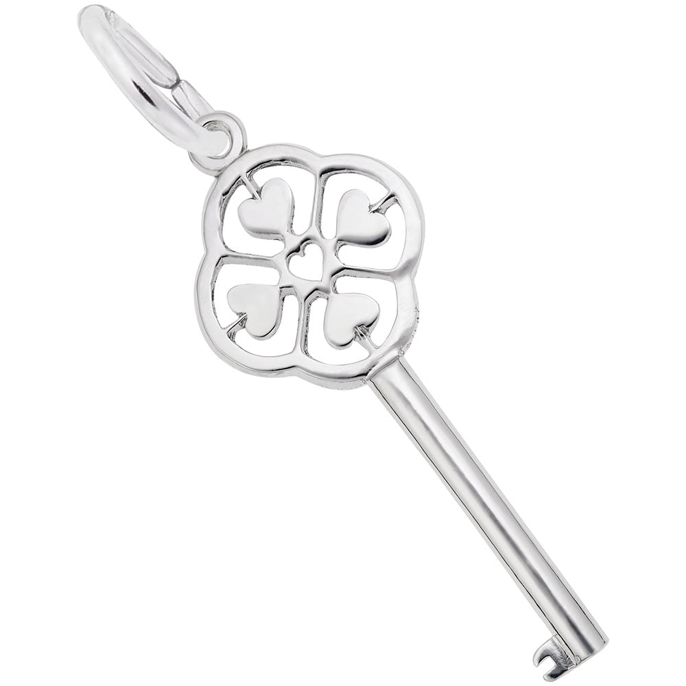 Silver key-shaped charm with decorative heart design on a white background
