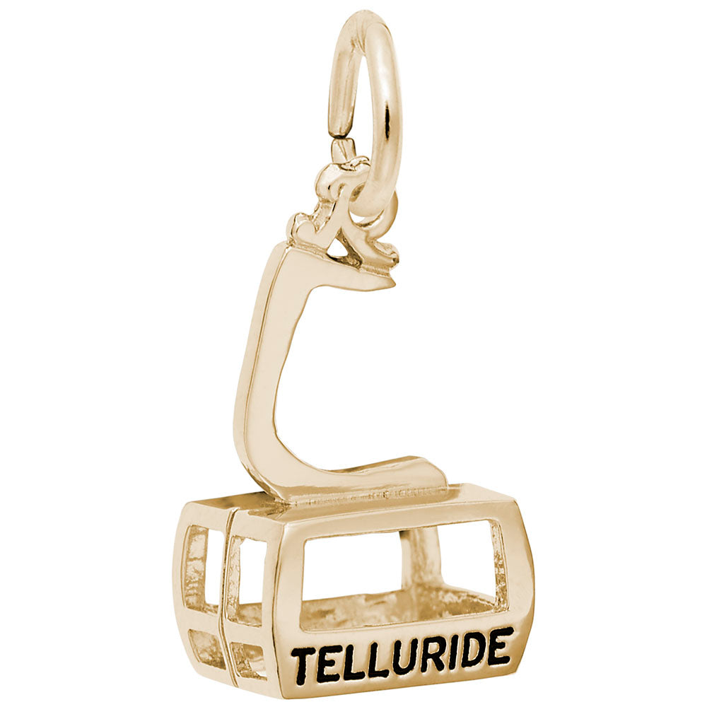 Gold cable car charm with 'Telluride' text on a white background