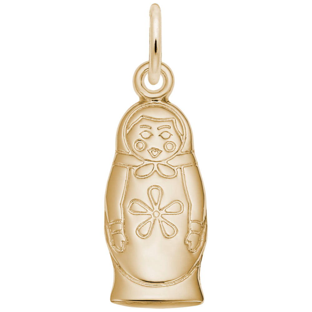 Gold charm shaped like a Russian nesting doll featuring an engraved face, floral motif on the chest on a white background