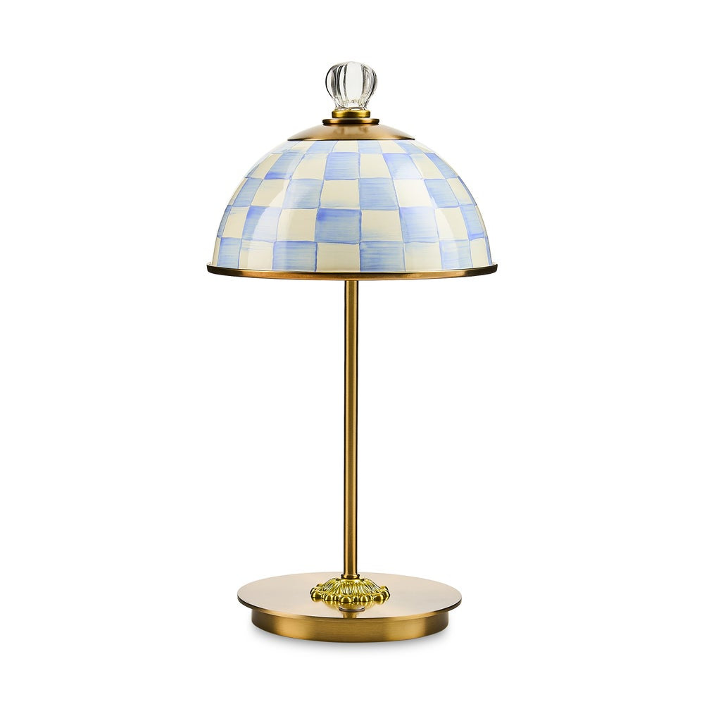 Table lamp with checkered blue and white shade on a white background
