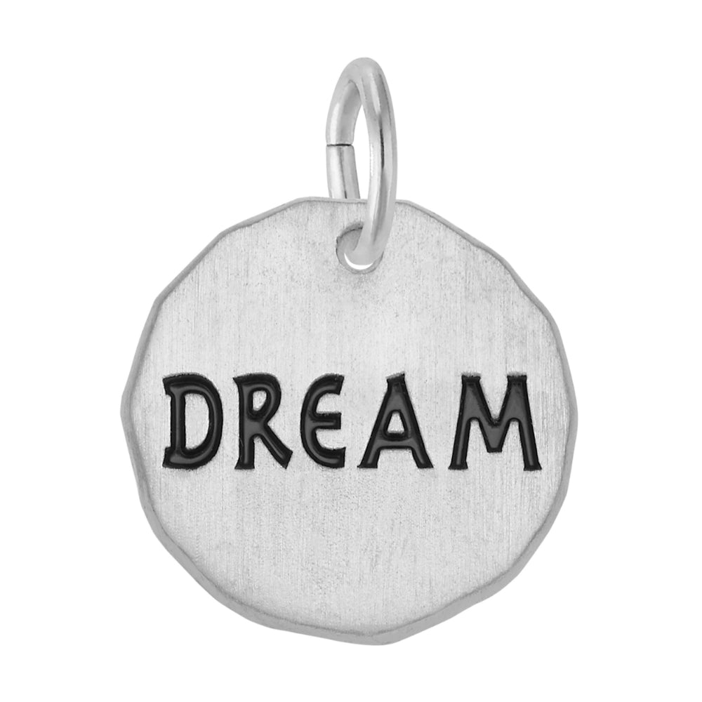 Silver disc charm engraved with "DREAM" shown on a white background 
