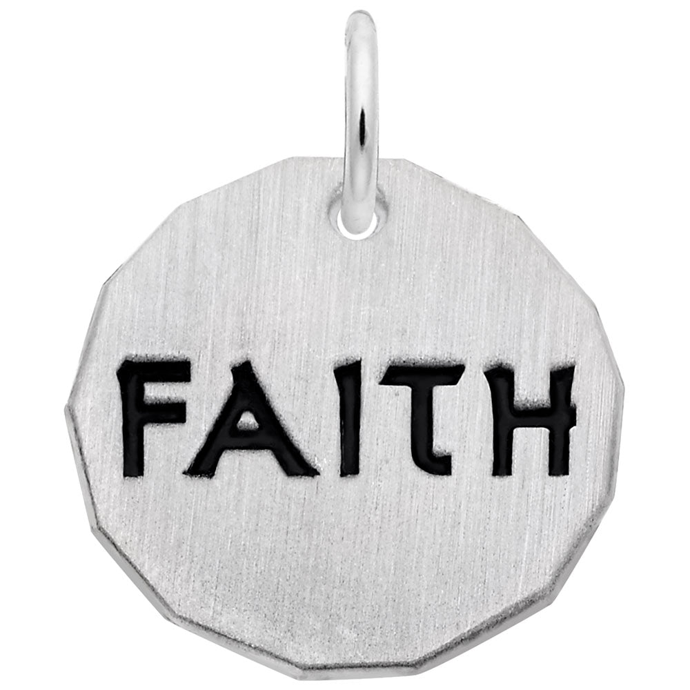 Silver disc charm with 'FAITH' engraved on it, on a white background