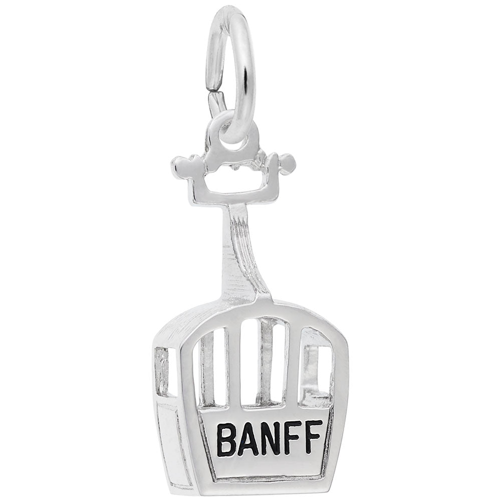 Silver gondola charm with 'BANFF' written on it on a white background