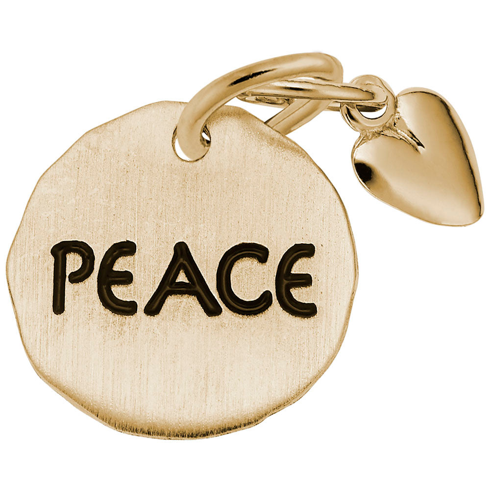 Gold disc charm engraved with 'PEACE' and a heart shaped dangle on a white background