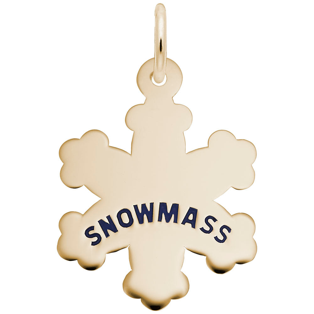 Gold snowflake cham engraved with 'SNOWMASS' on a white background