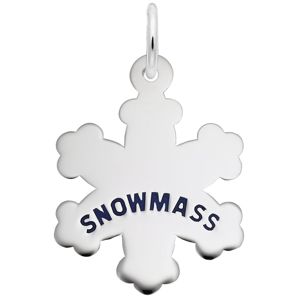 Silver snowflake cham engraved with 'SNOWMASS' on a white background