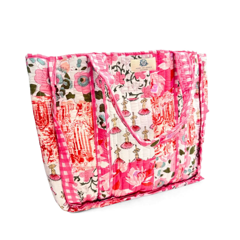 Heart of Grace quilted multi-color and pattern bag on a white background