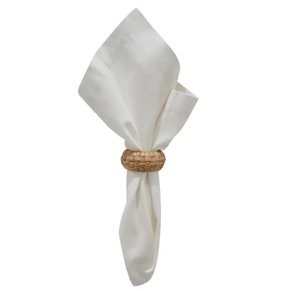 Rattan Woven Napkin Ring around white napkin on white background.