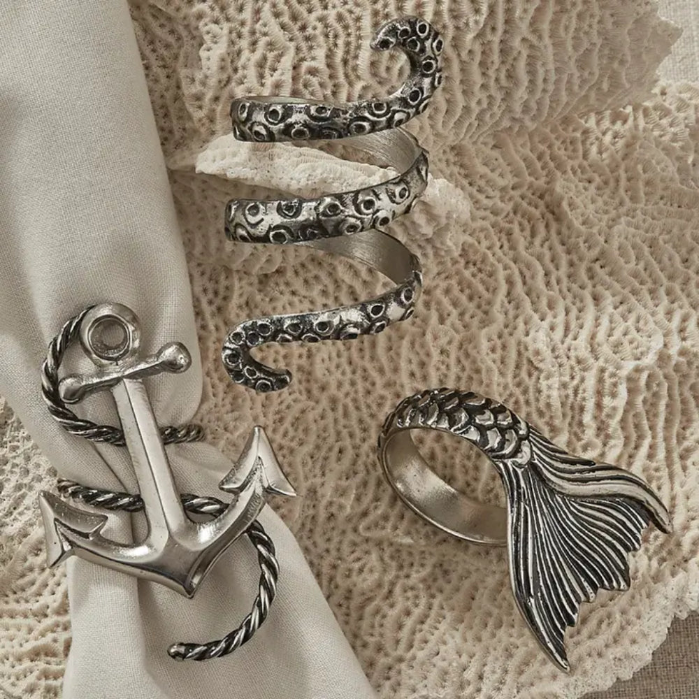 Napkin rings displayed aound napkins and display surface. 