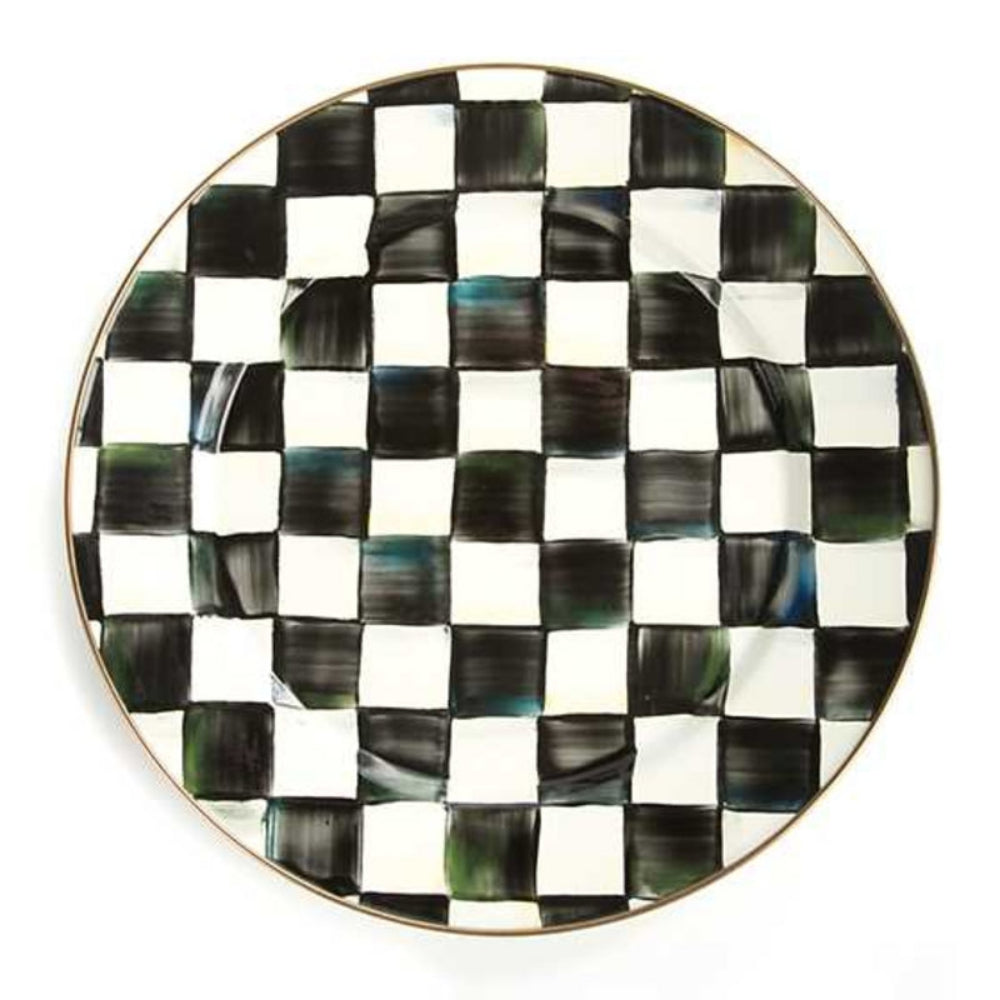Round plate with black and white checkered pattern on a white background