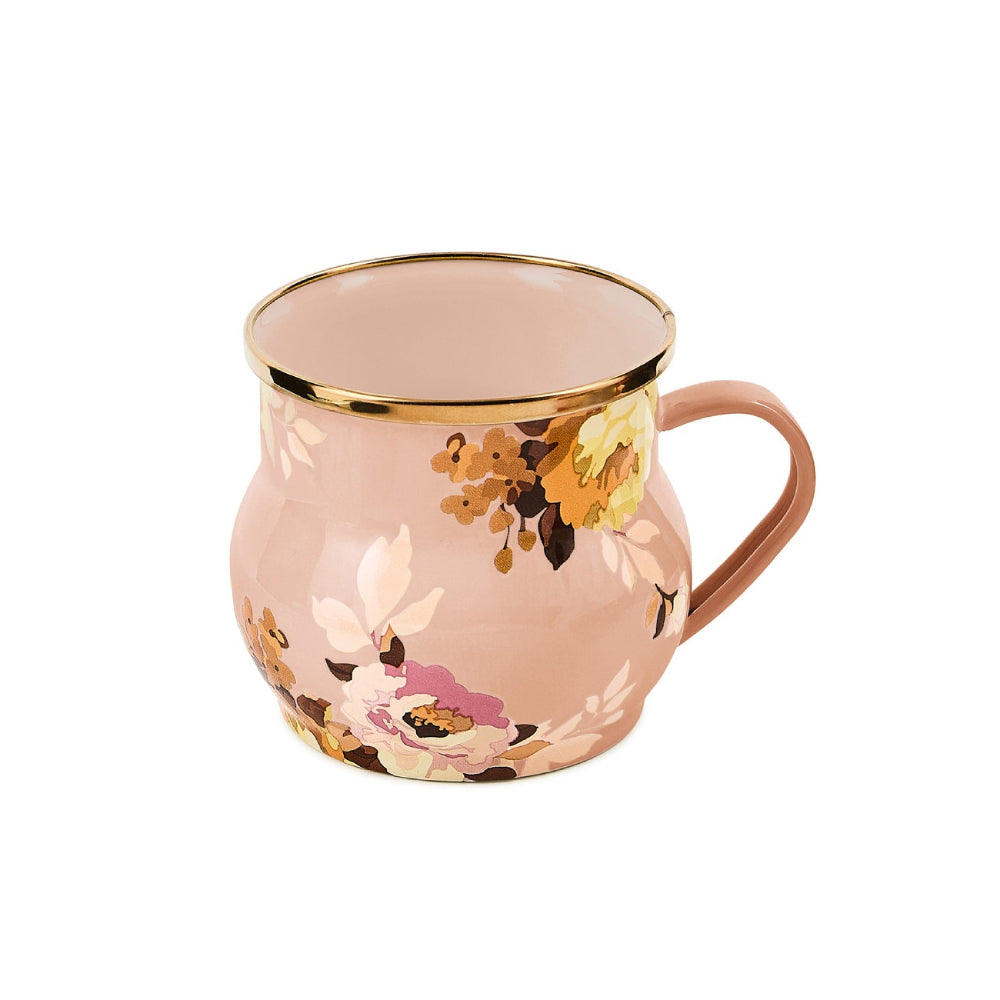 Pink mug with floral design and gold rim on a white background
