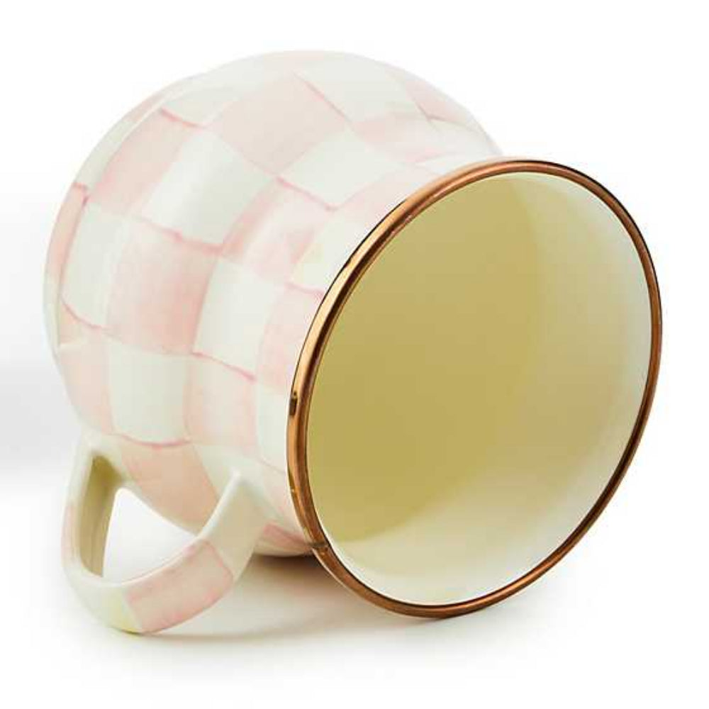 Side photo of  a mug with rosy pink and white checkered pattern and gold rim on a white background