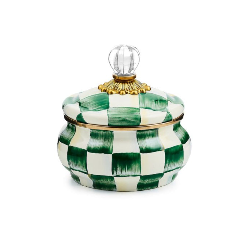 Decorative ceramic jar with green and white checkered pattern on a white background.