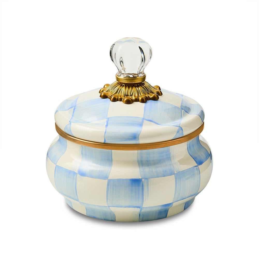 Decorative jar with blue and white checkered pattern and gold accents on a white background.