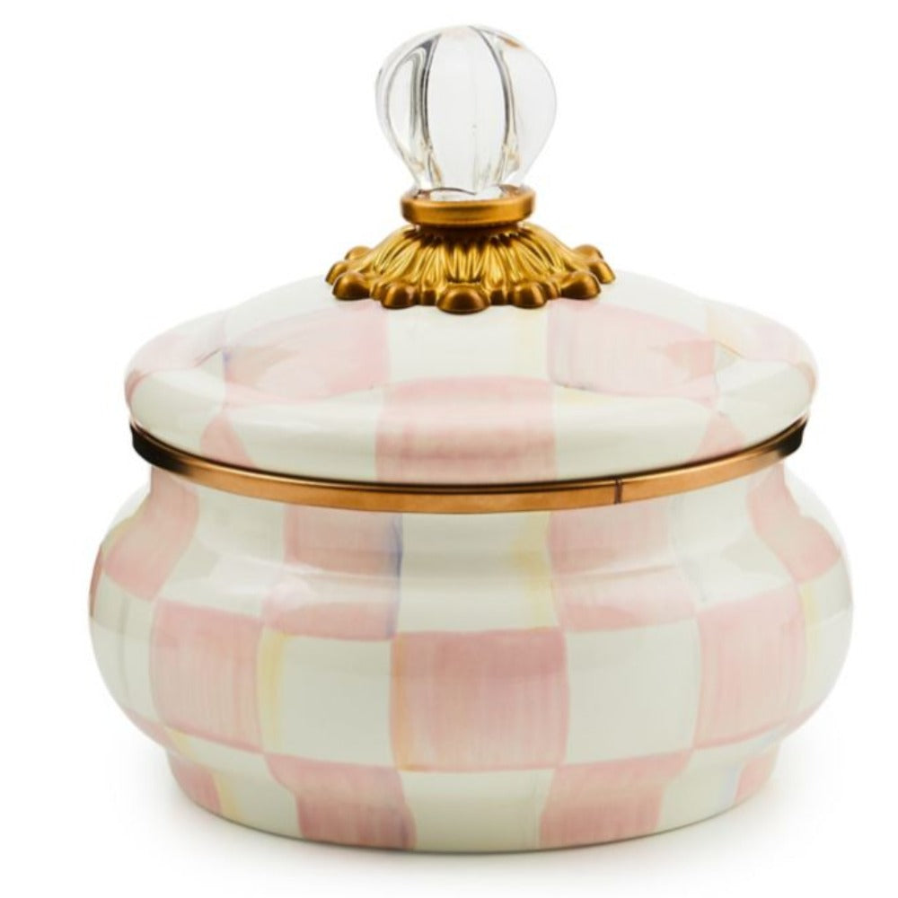 Decorative jar with a rosy pink and white checkered pattern and gold accents on a white background