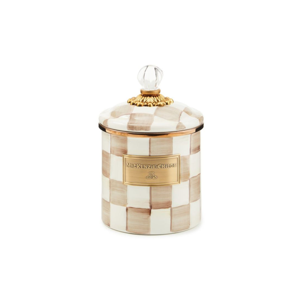 Small decorative jar with a mocha checkered pattern and gold accents on a white background.