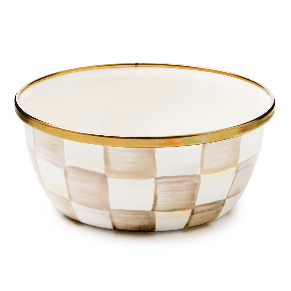 Mocha Checkered patterned bowl with gold rim on a white background.