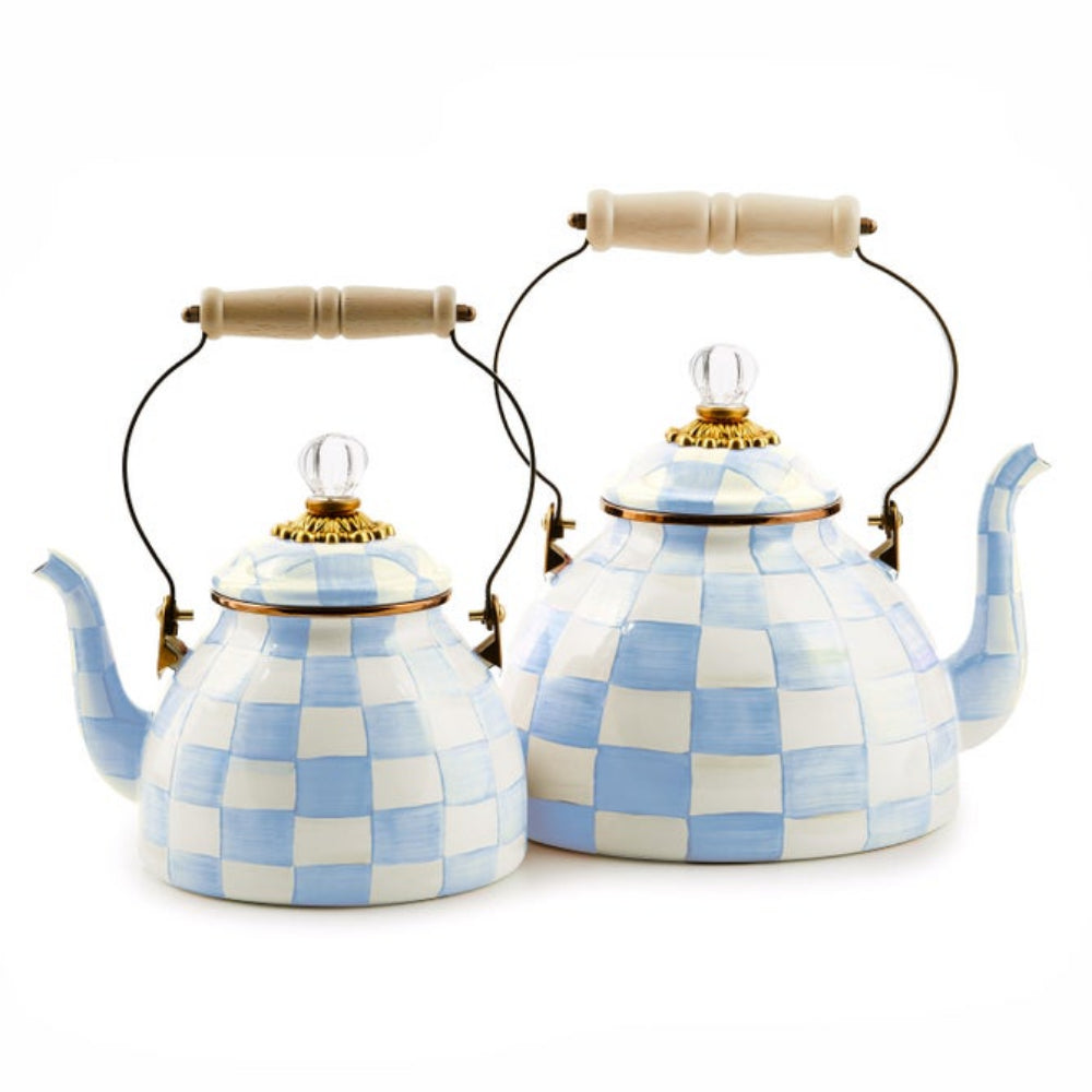 Two sky check tea kettles with wooden handles and sky check lids on a white background