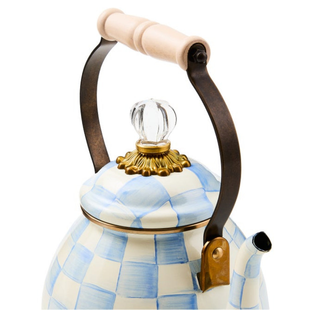 Tea kettle with blue and white checkered pattern on a white background with lid and handle