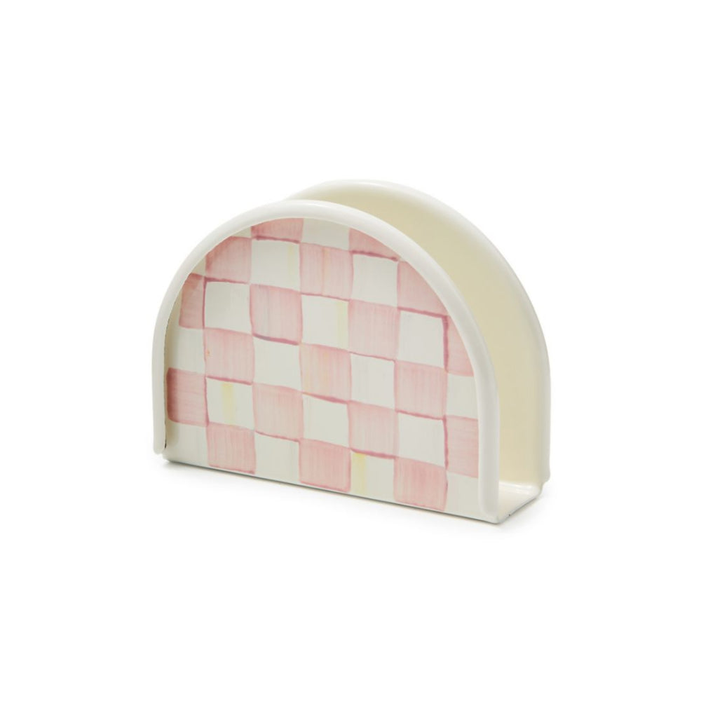 Checkered pink and white napkin holder on a white background.