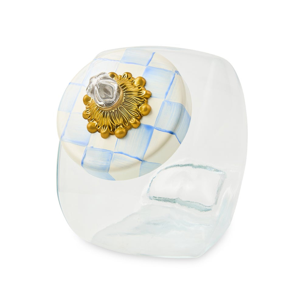 Decorative knob with gold emblem and sky blue checkered pattern on a white background.