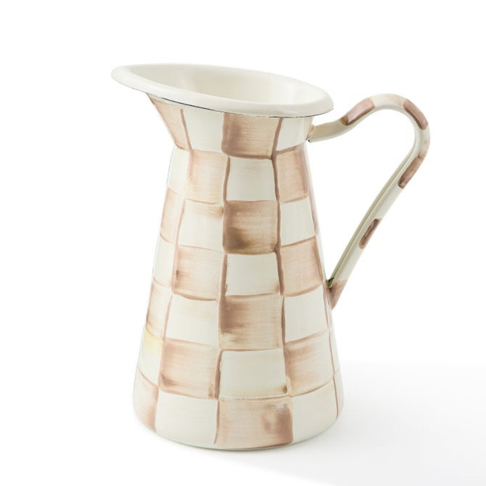 Ceramic pitcher with mosaic pattern on a white background