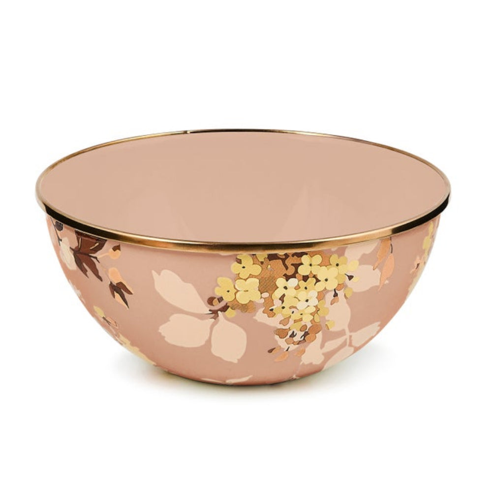 A round ceramic bowl with a dusty rose pink exterior decorated with gold and beige floral patterns, featuring a shiny gold rim, set against a plain white background.