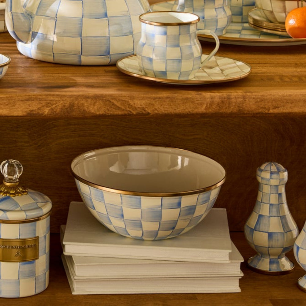Checkered sky check ceramic tableware including a bowl, mug, salt and pepper shakers, and other various sky check decor items on a wooden surface.