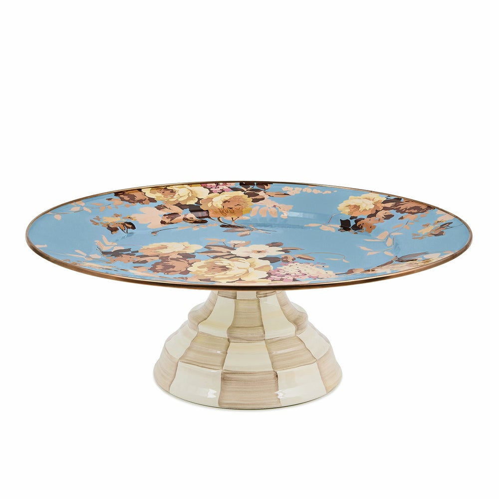 Decorative cake stand with floral design on a blue background