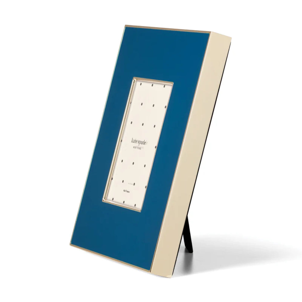 A side angled photo of the Kate Spade Make It Pop Navy 4x6 Photo Frame on  a white backround.