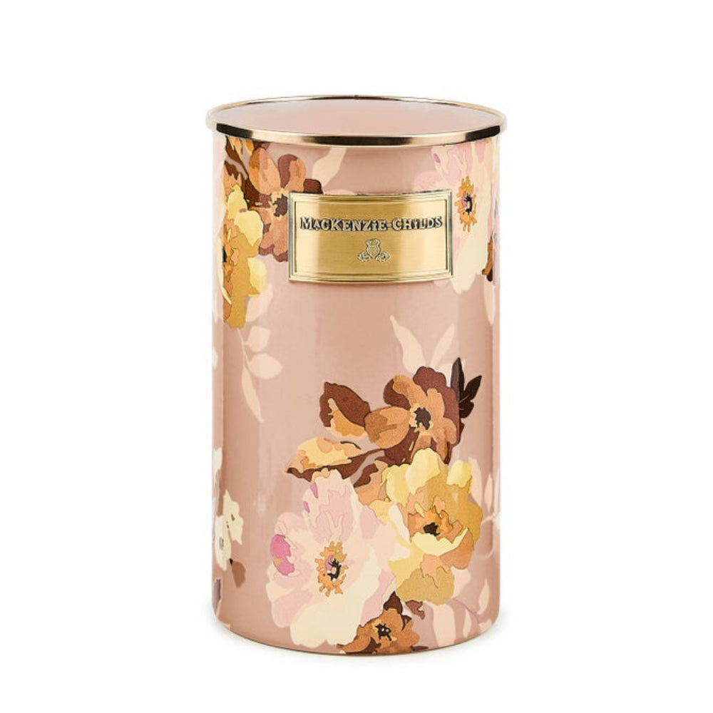 Floral-patterned utensil holder with a gold lid and label on a white background