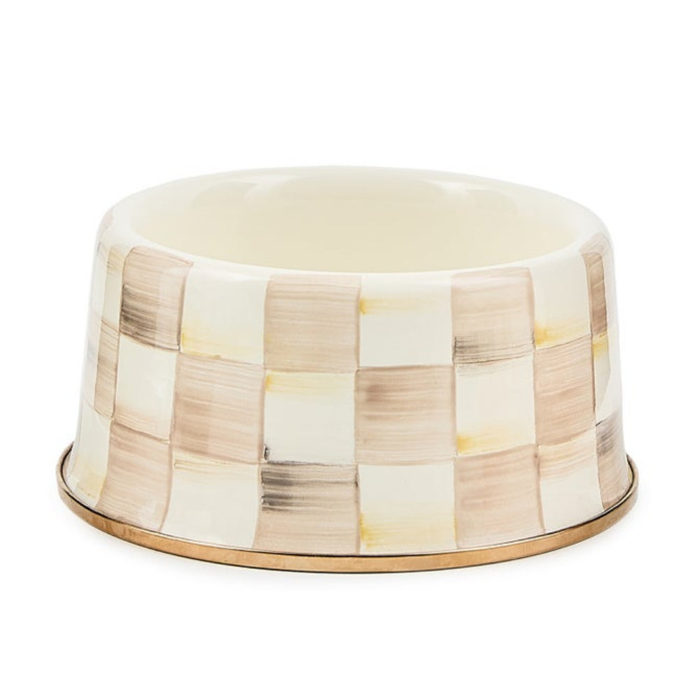 Decorative pet bowl with a checkered pattern on a white background
