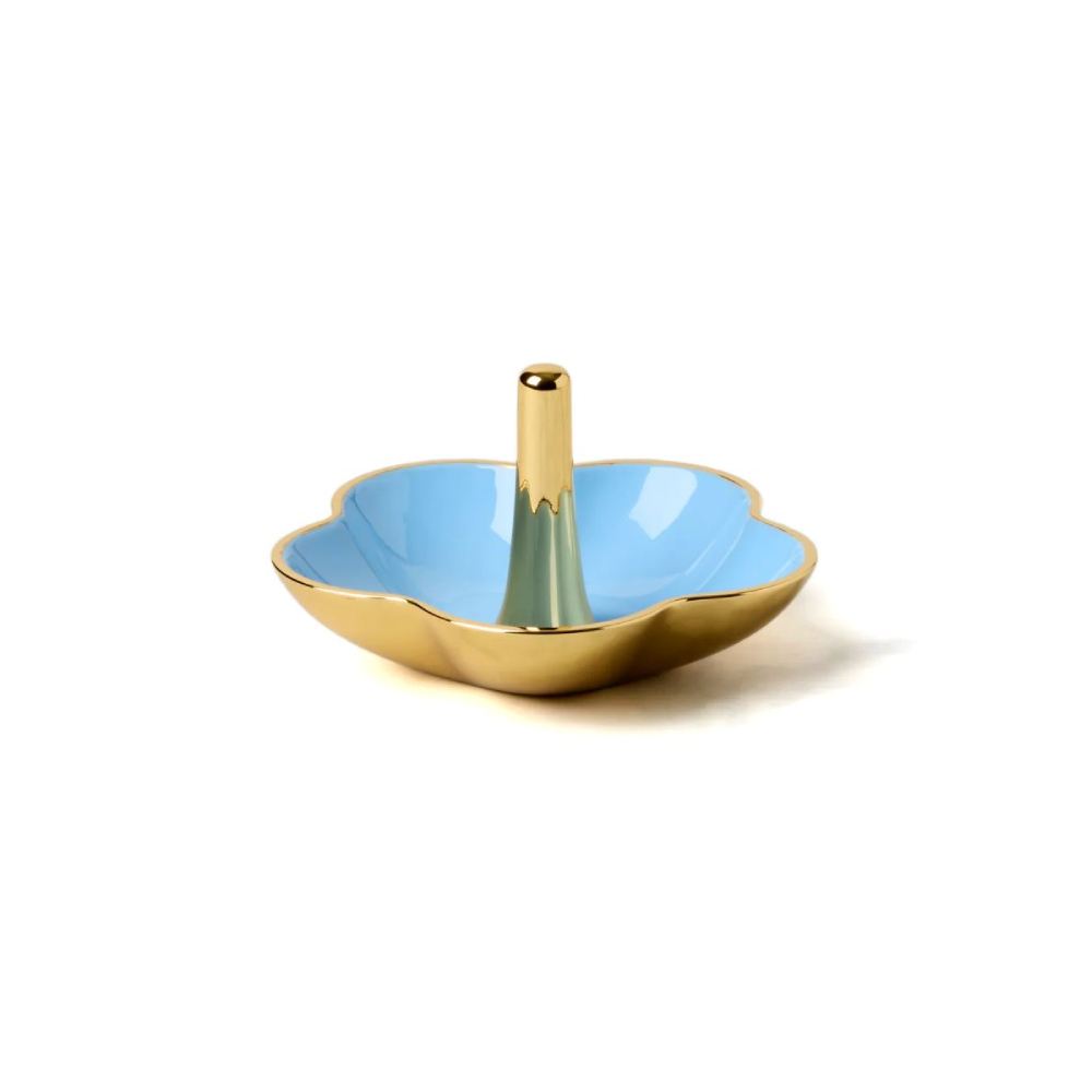 Decorative gold ring dish with blue interior and gold exterior on a white background.