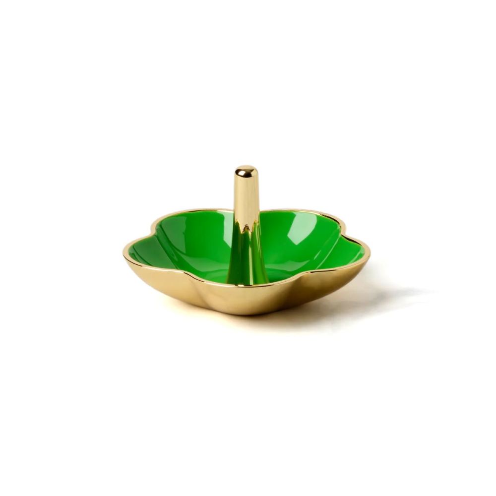 Decorative gold ring dish with green interior and gold exterior on a white background.