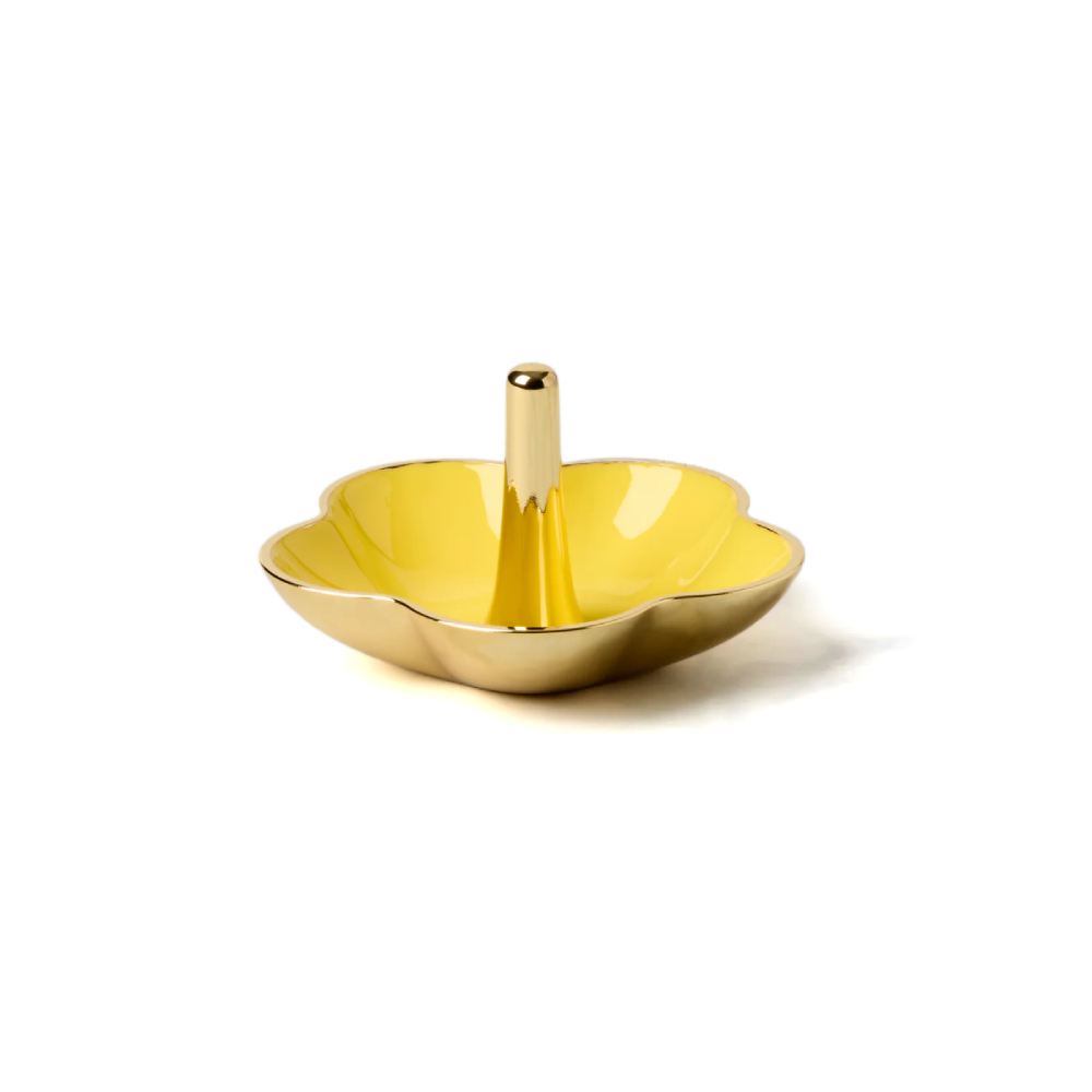 Decorative gold ring dish with yellow interior and gold exterior on a white background.