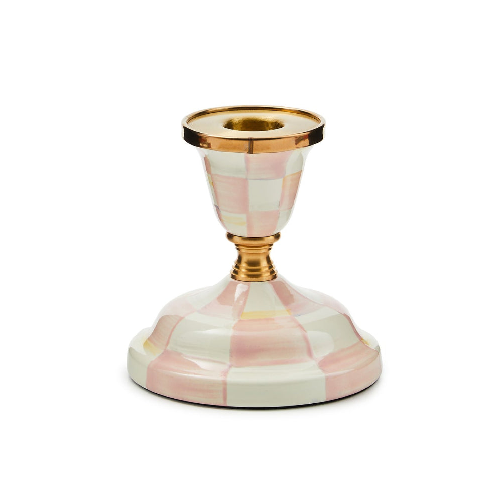 Candle holder with pink and white checkered design and gold accents on a white background