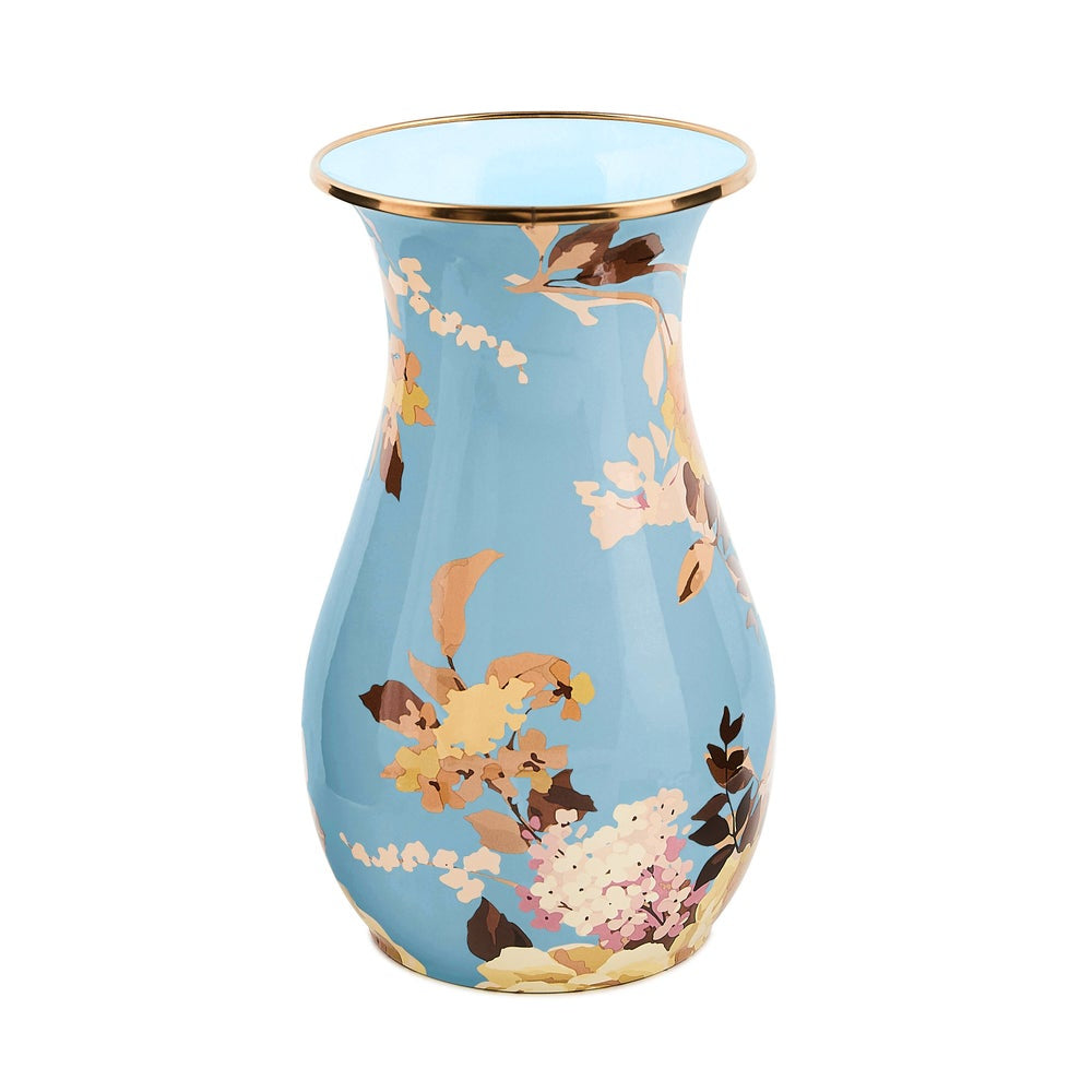Decorative vase with floral design on a light blue background