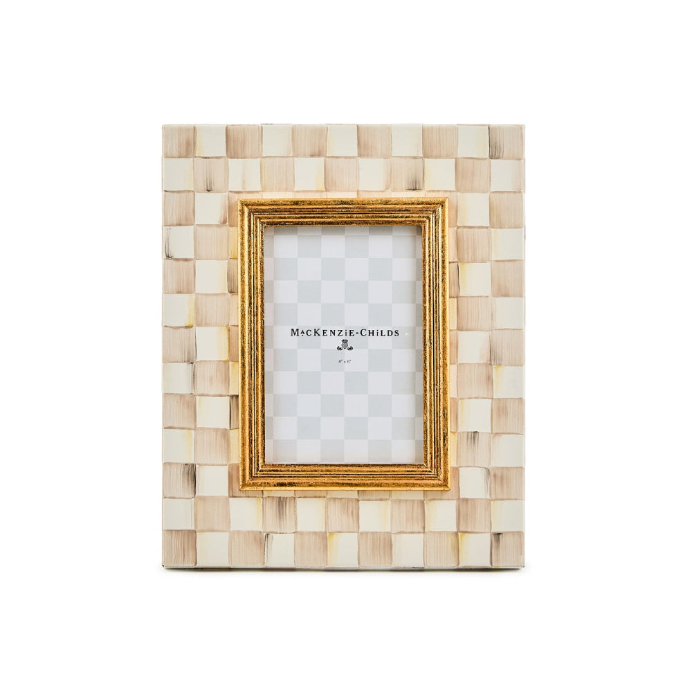 Decorative picture frame with mosaic design and gold accents on a white background