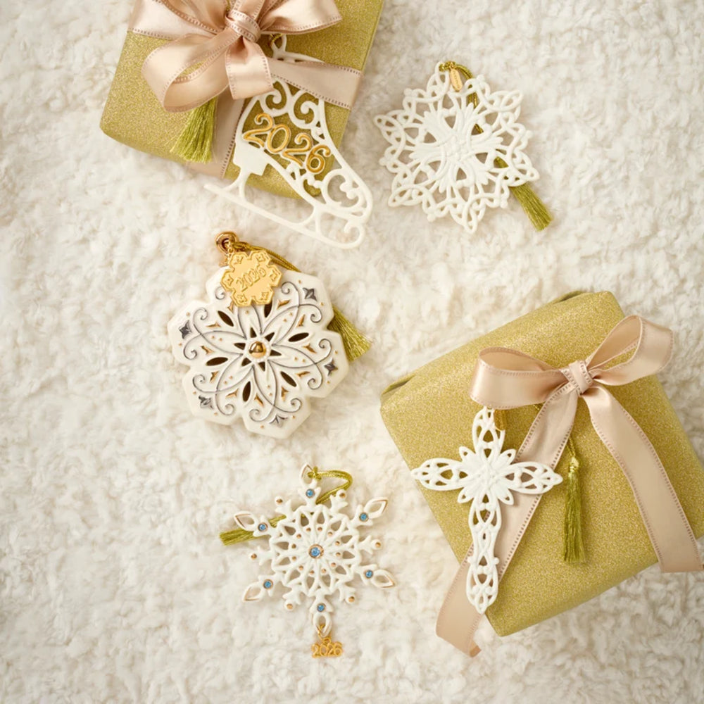 Decorative Christmas ornaments and gift boxes on a textured surface