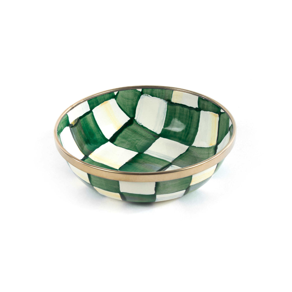 Checkered ceramic bowl with green and white pattern on a white background.