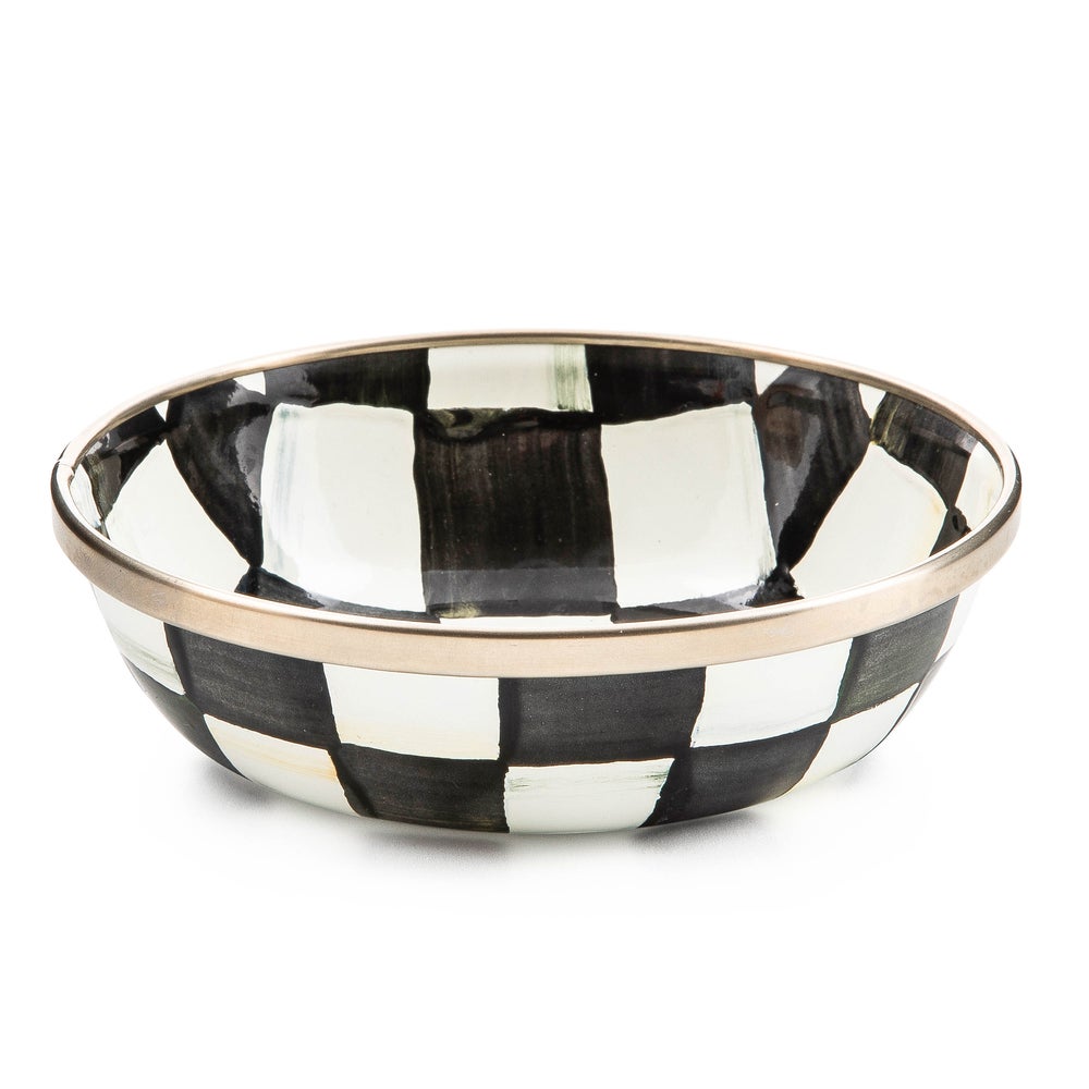 Black and white checkered bowl with gold rim on a white background